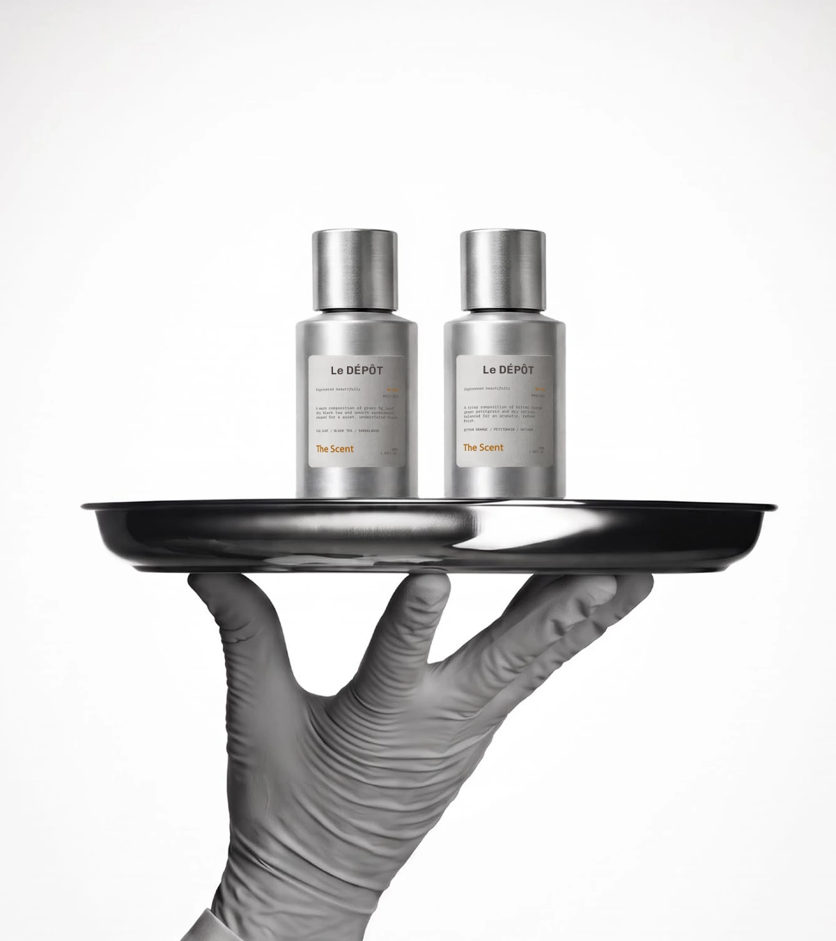 Silver fragrance bottles on a serving tray
