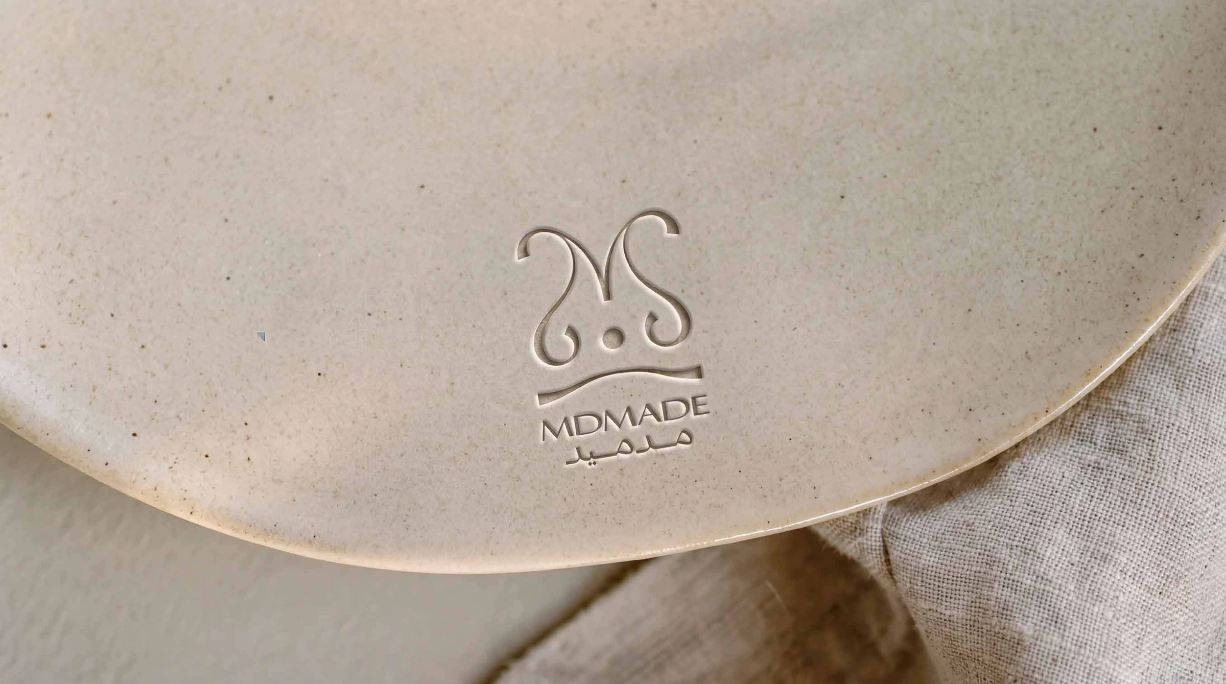 MDMADE mark embossed in ceramic